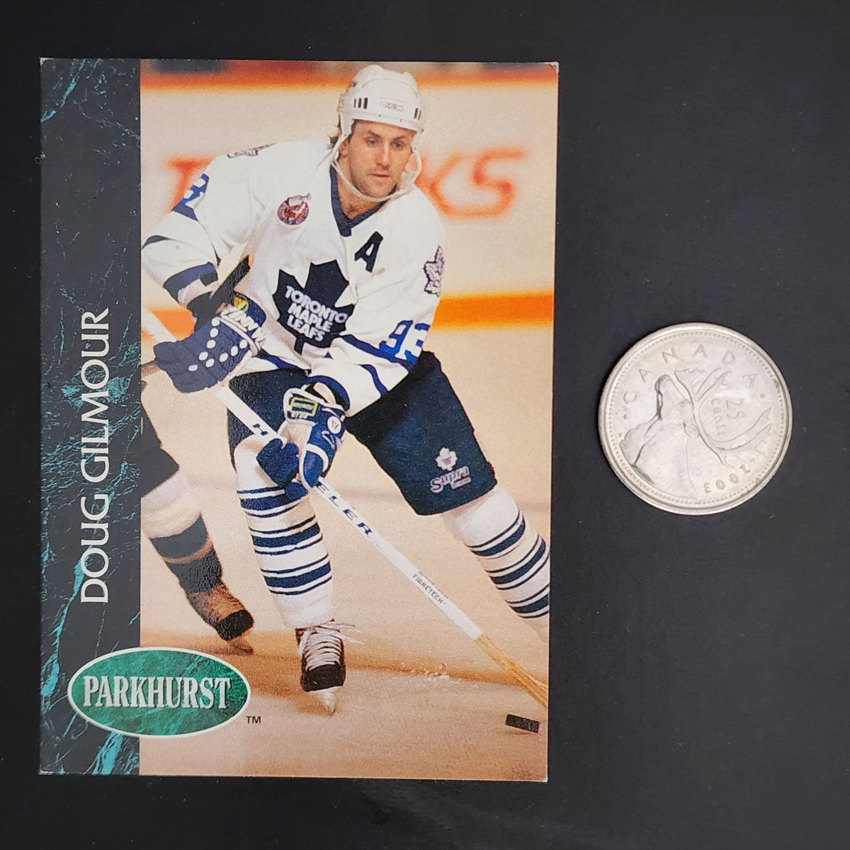 Doug Gilmour hockey card - A trading card featuring Doug Gilmour, a professional hockey player.