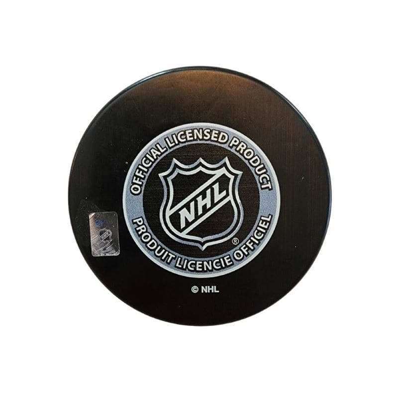 Autographed hockey puck by Pierre Pilote