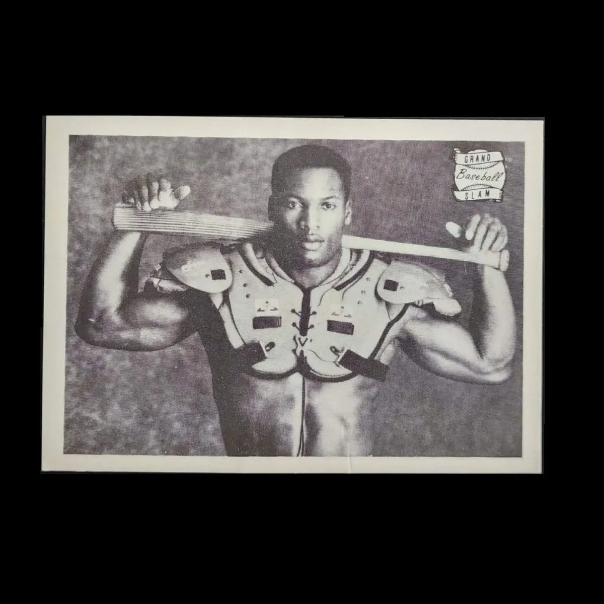 Black and white picture of a Bo Jackson gripping a baseball bat.