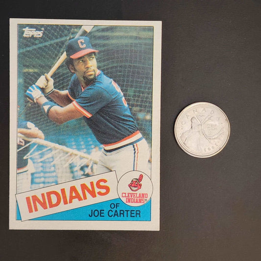 A baseball card featuring a coin beside it, showcasing a valuable collectible item.